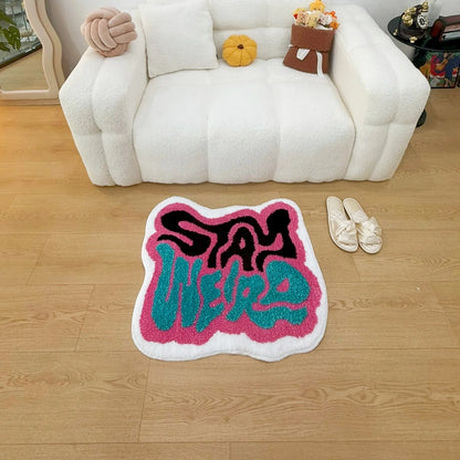 STAY WEIRD Rug