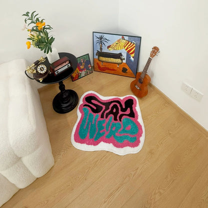 STAY WEIRD Rug