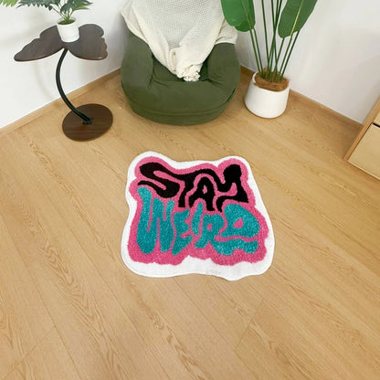 STAY WEIRD Rug